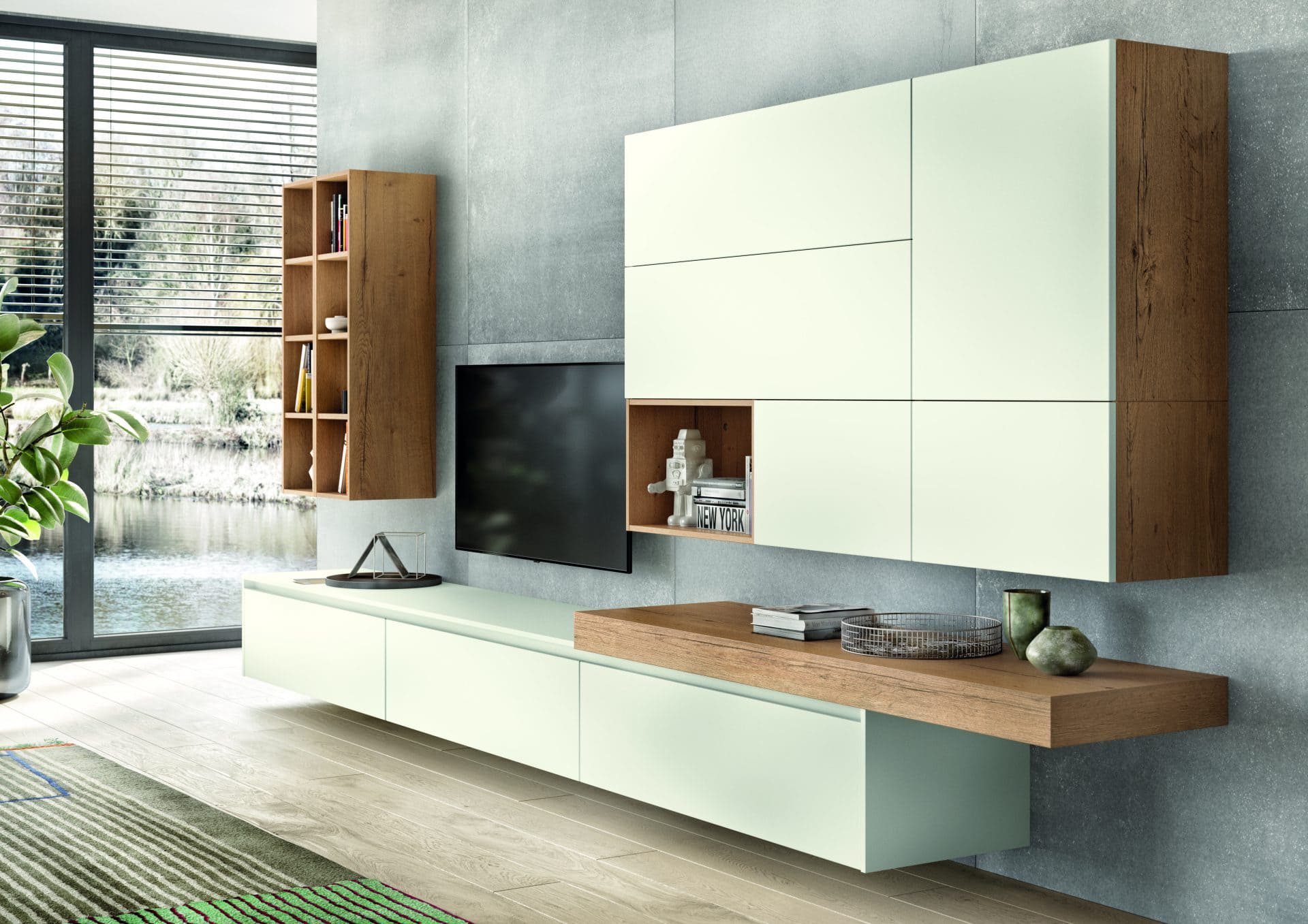 Ein modernes Wohnzimmer mit einer grünen Wandunit, stilvoll eingerichtet und gut beleuchtet.